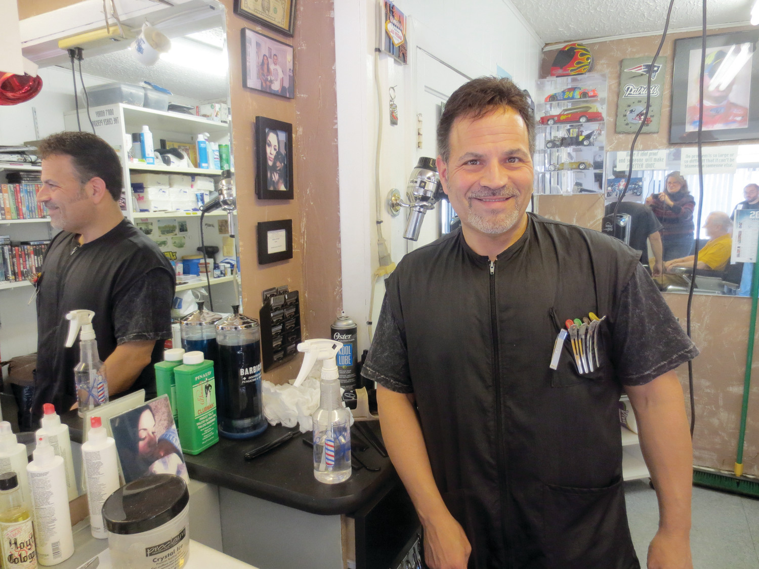 Dave Picozzi is seen here in front of his longtime barber shop on Post Road where he and his son Geno have been improving the looks of men and boys in Warwick for generations.  Come by for your fall haircut – walk-ins are always welcome!